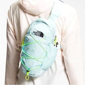 The North Face Light Blue Backpack with Neon Accents
